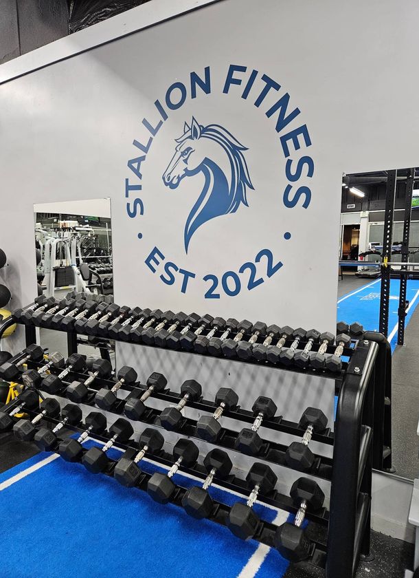 man lifting weights in a gym